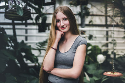 Portrait of beautiful young woman standing outdoors