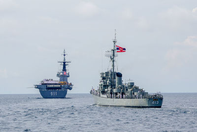 Ship sailing on sea against sky