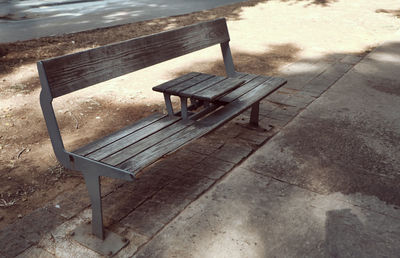 High angle view of empty bench in park