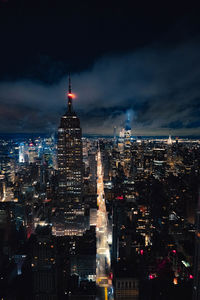 Illuminated buildings in city at night