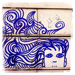 Close-up of graffiti on wall