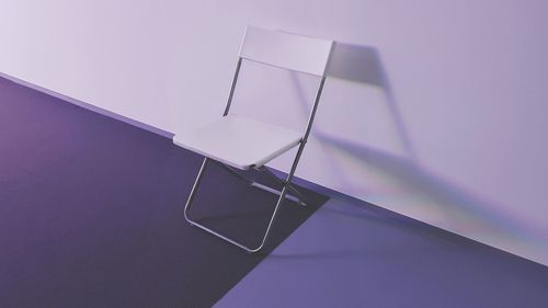 High angle view of empty table against blue background