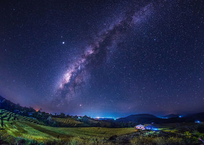 Scenic view of star field against sky at night