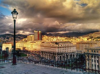 Buildings against cloudy sky