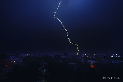 Lightning over city at night