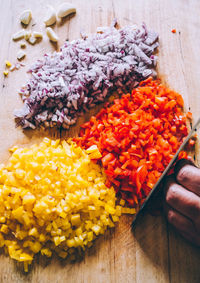 Close-up of person cutting vegetables on table