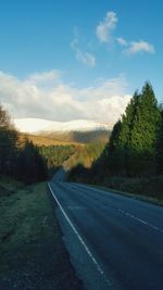 Empty road against sky