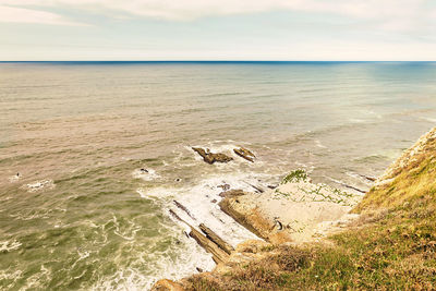 Scenic view of beach against sky