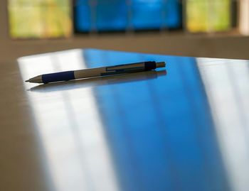 Close-up of pen on table