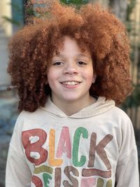 Portrait of cute redhead young boy