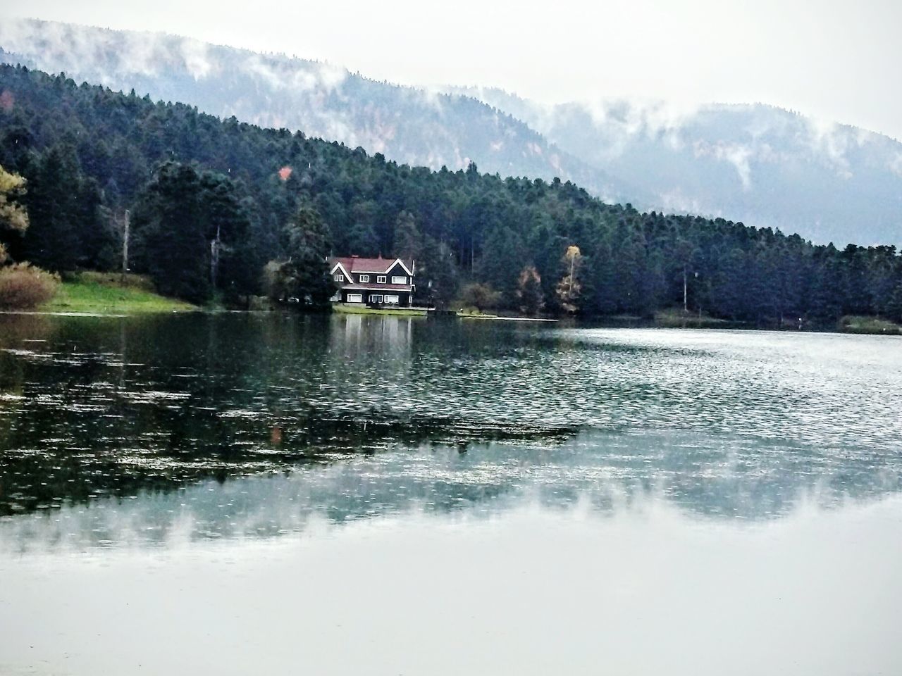 water, mountain, tree, nature, mountain range, scenics, lake, no people, beauty in nature, outdoors, sky, tranquil scene, tranquility, day, built structure, cloud - sky, architecture