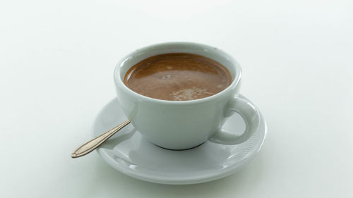 Close-up of coffee on white background