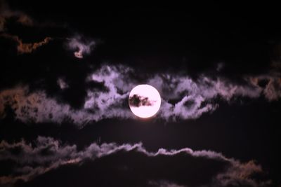 Low angle view of half moon against sky at night