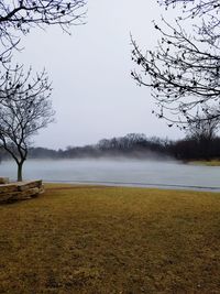 Scenic view of lake against sky during winter