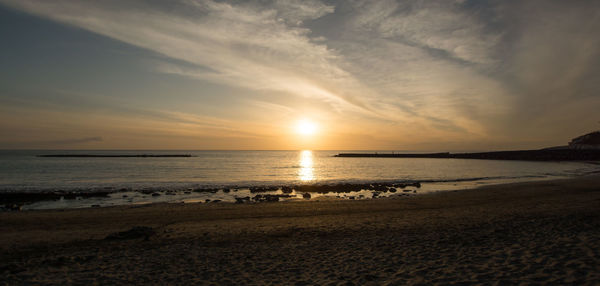 Scenic view of sea against sky during sunset