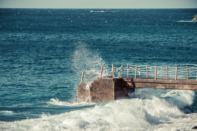 Scenic view of sea against blue sky