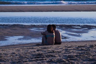 Woman sitting on beach