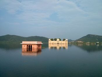 Scenic view of lake with mountains in background