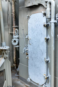 Close-up of old pipe against wall