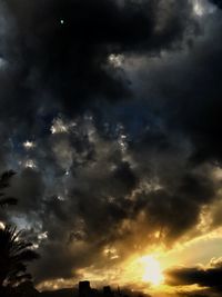 Low angle view of dramatic sky during sunset