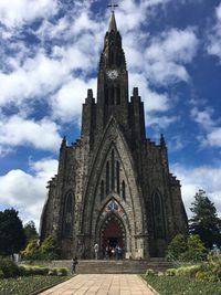 Low angle view of cathedral against cloudy sky