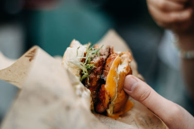 Close-up of hand holding meat