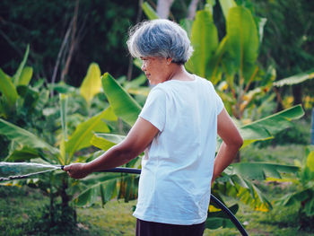 Boy watering plants