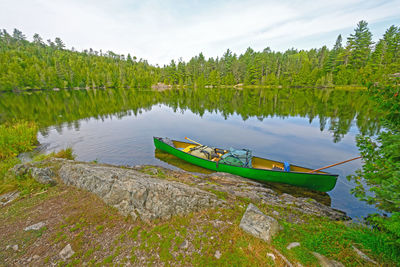 Canoe on the wilderness shore of ottertrack lake in the boudnary waters of minnesota