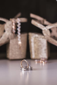 Close-up of wedding rings on table