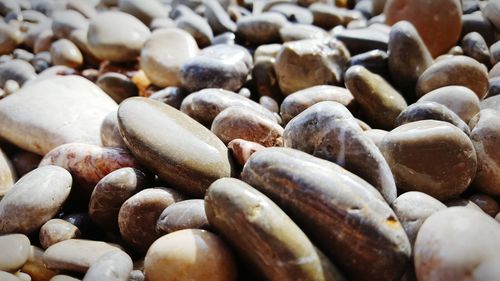 Full frame shot of stones on sunny day