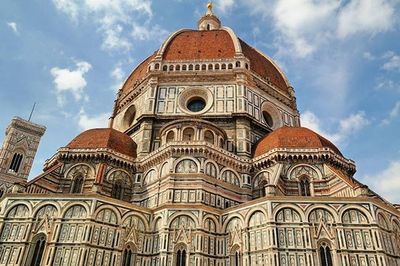 Low angle view of cathedral against cloudy sky