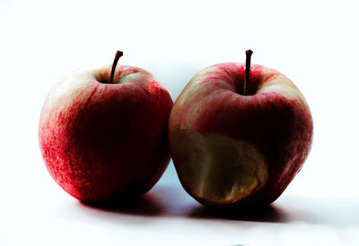 Close-up of cherries against white background