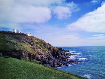 Scenic view of sea against cloudy sky