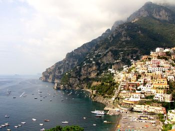 Scenic view of sea with mountains in background