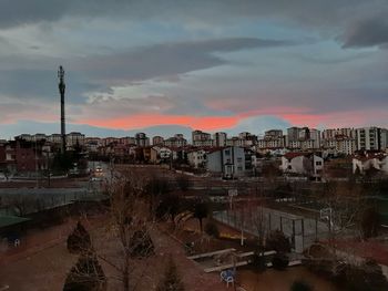 High angle shot of townscape against sky at sunset