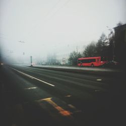 Cars on road against sky