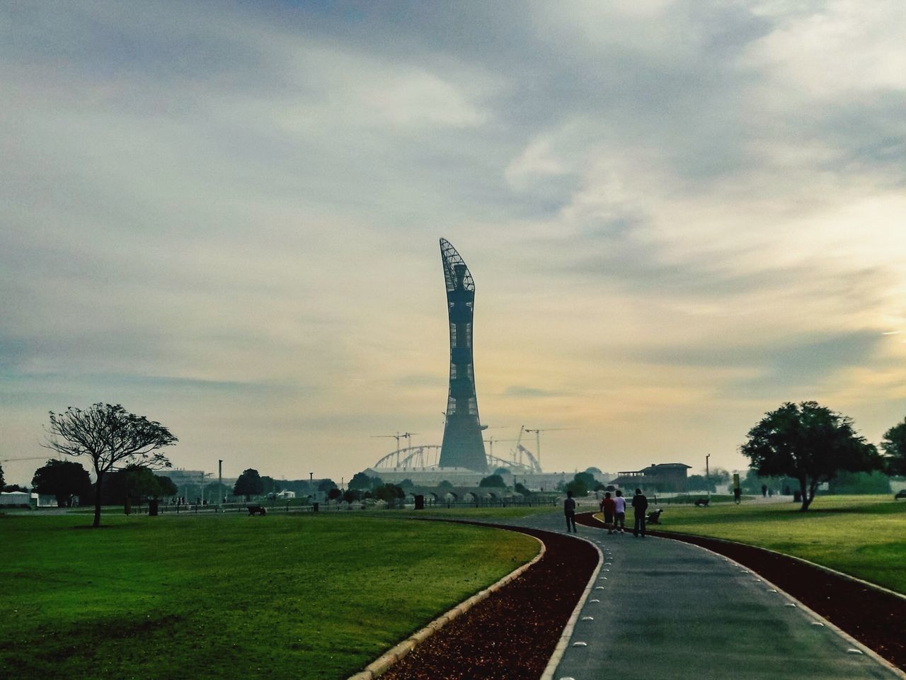 sky, horizon, cloud, architecture, travel destinations, plant, travel, grass, nature, tourism, built structure, tree, morning, environment, landmark, city, dusk, transportation, tower, road, outdoors, landscape, the past, history, no people, rural area, memorial, monument, hill, plain, sunlight