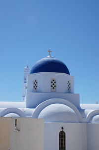 View of white building against blue sky
