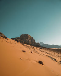 Scenic view of desert against clear sky