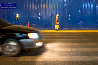 Blurred motion of car on street at night