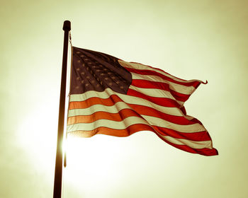 Low angle view of flag against sky