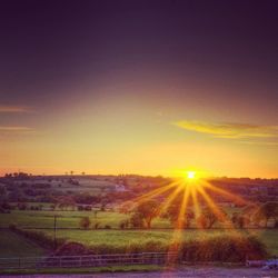 Scenic view of landscape at sunset