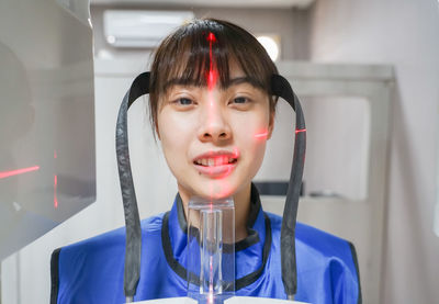 Portrait of smiling man holding glass