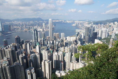 Aerial view of modern buildings in city against sky