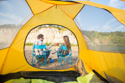 People sitting in tent