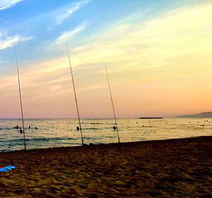 Scenic view of beach against sky during sunset