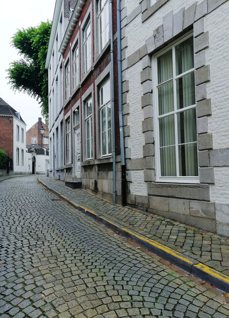 STREET AMIDST BUILDINGS IN TOWN