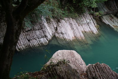 High angle view of rock formation in lake