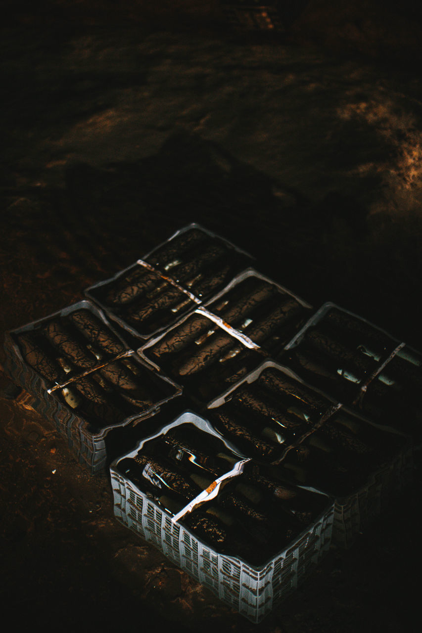 HIGH ANGLE VIEW OF RUSTY METAL ON TABLE