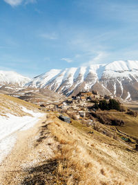 Scenic view of snowcapped mountains against sky